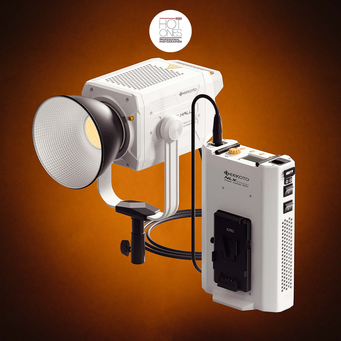 Studio light with power supply on an orange background, featuring 'HOT ONES' branding.